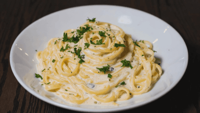 Creamy pasta garnished with parsley