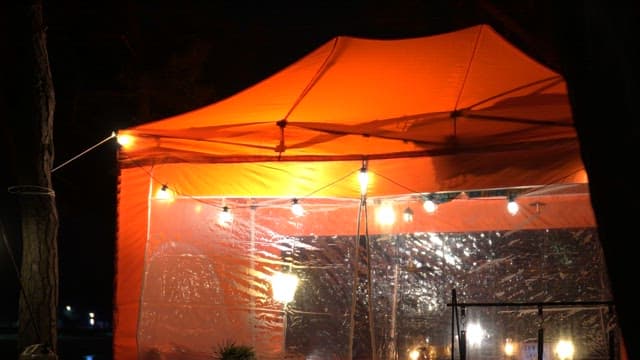 Cozy orange tent at night