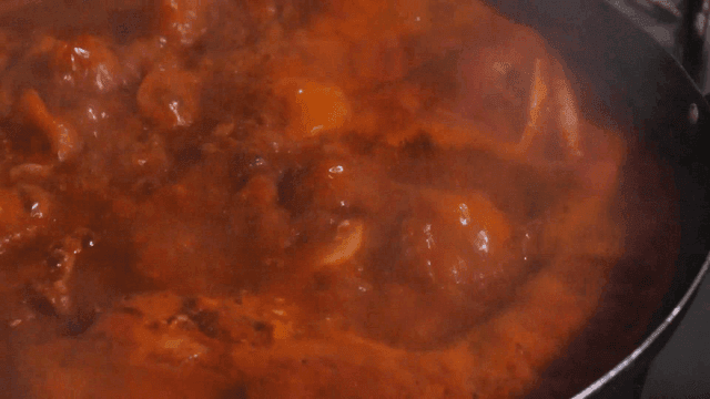 Pork backbone stew boiling in a pot