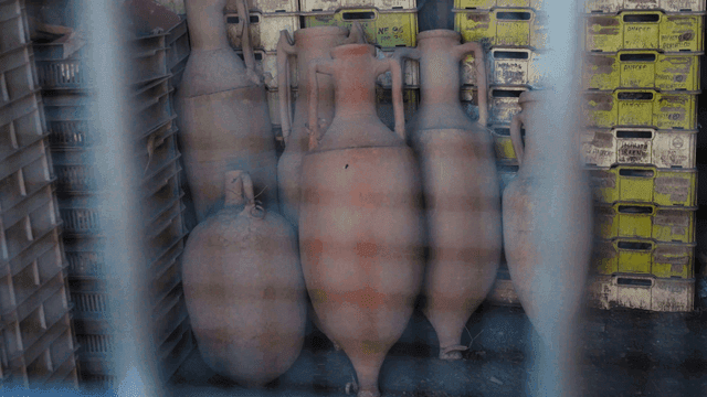 Ancient clay pots stored in a warehouse