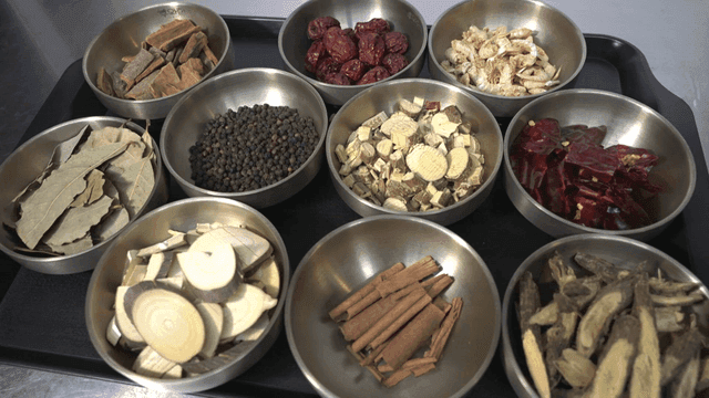 Various herbs and spices in metal bowls