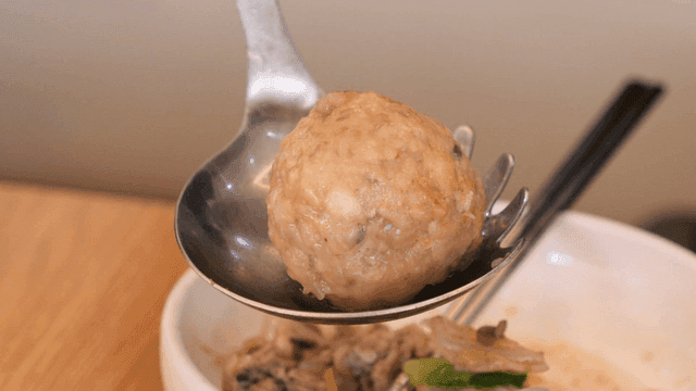 Rolled dumplings lifted from bowl