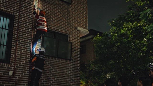 Firefighters doing Rescue Operation by Climbing Building Pipes