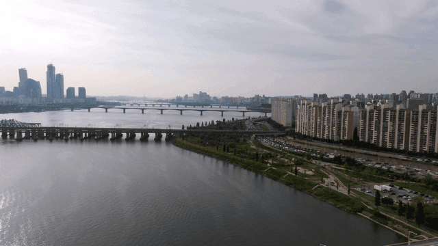 Bustling city with river and bridge