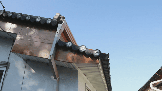 Traditional hanok roof under clear sky