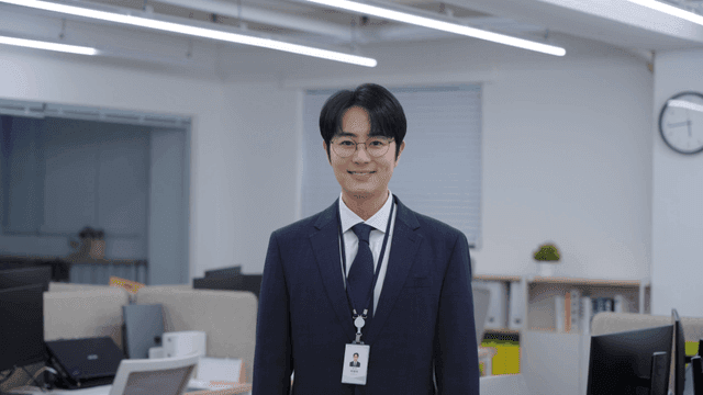 An office worker smiling in an office