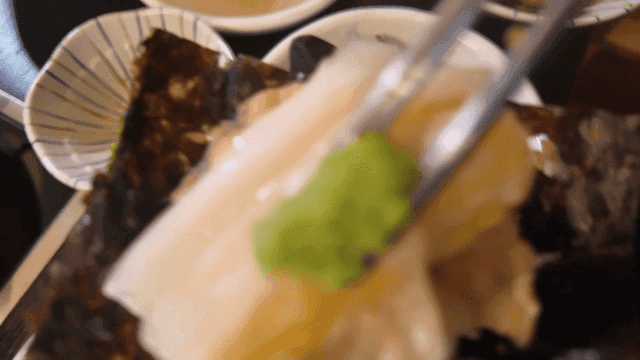 Chopsticks for placing wasabi on top of boiled anglerfish on seaweed