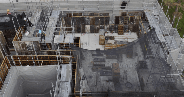 Construction site with scaffolding and workers