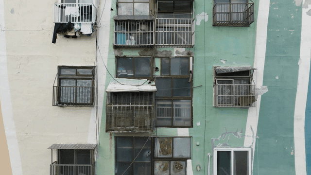 Old apartment building with worn facade