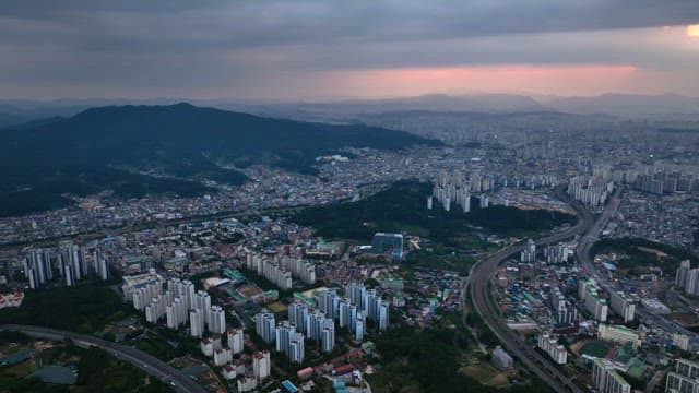 Beautiful sunset view of the city surrounded by mountains
