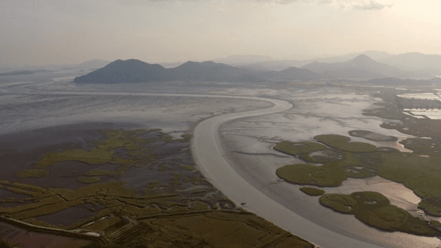 Winding river through a vast landscape