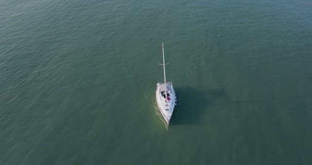 Yacht sailing on calm waters