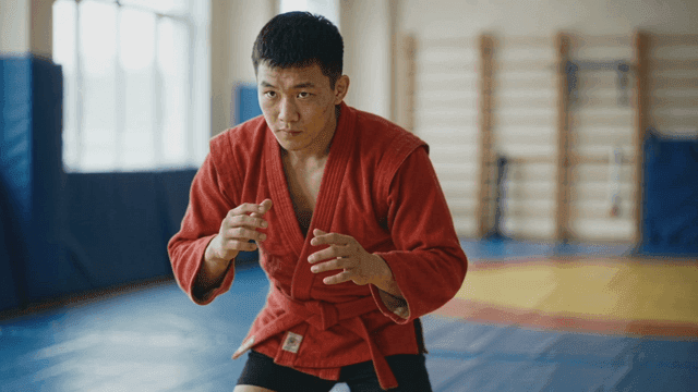 Man practicing martial arts at gym