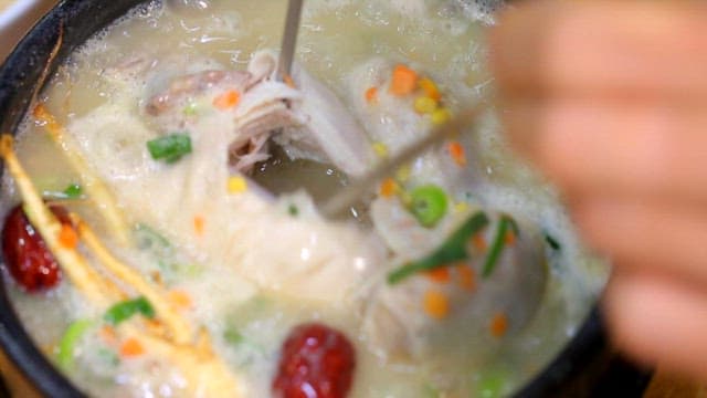 Ginseng chicken soup boiling in a hot pot