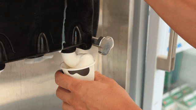 Soft serve ice cream being dispensed