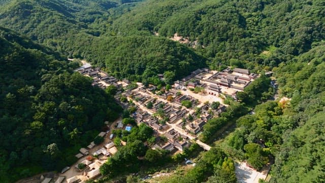 Traditional Korean house village nestled in lush mountains