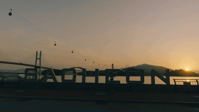 Sunset view of Sacheon with cable cars