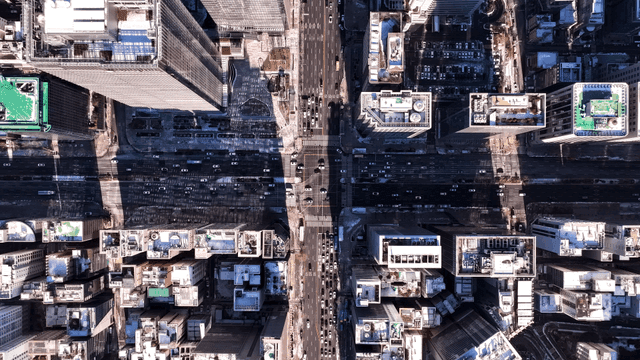 Busy city intersection with high-rise buildings