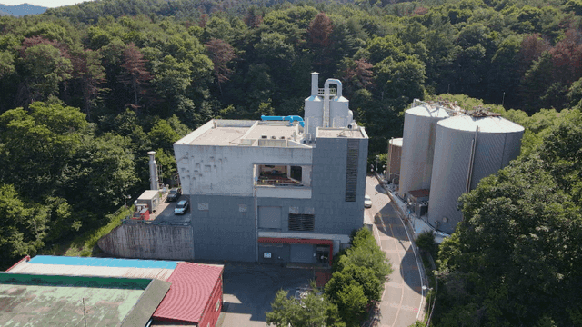 Industrial facility surrounded by forest