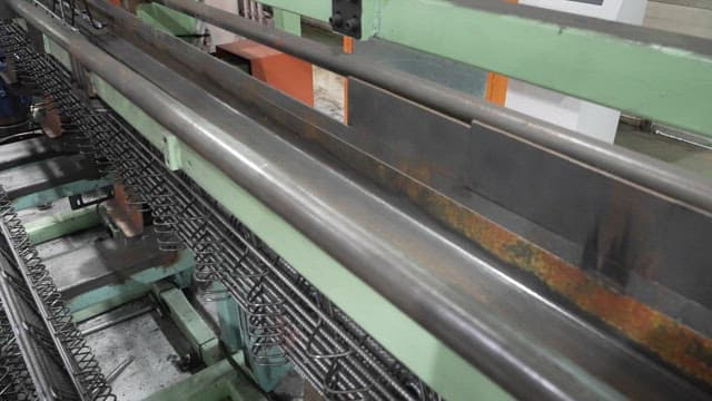 Metal springs being processed in a factory