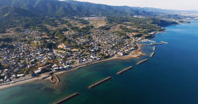 Coastal town with mountains and sea