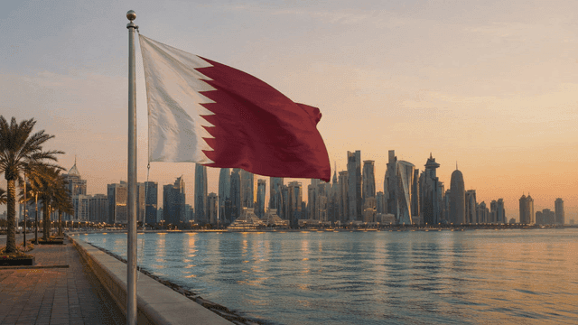 Sunset city skyline with Qatari flag