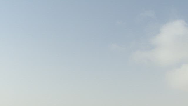 Aerial View of Traffic on a Bridge over the River