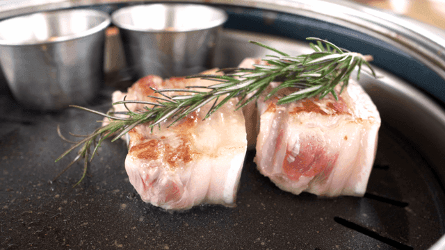 Pork belly grilled with rosemary on pan