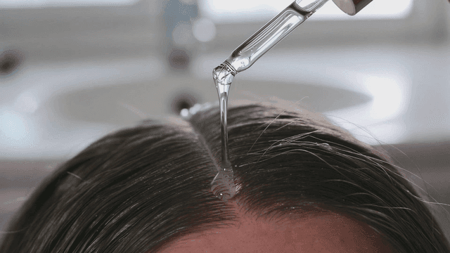 Applying serum to the scalp