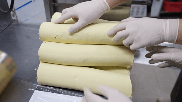 Dough being prepared in a kitchen