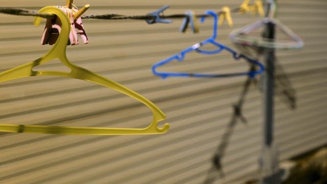 Clothes hangers on a line outdoors