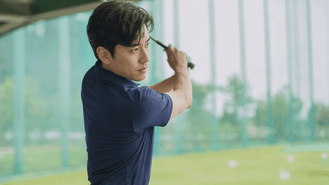 Man practicing golf swing