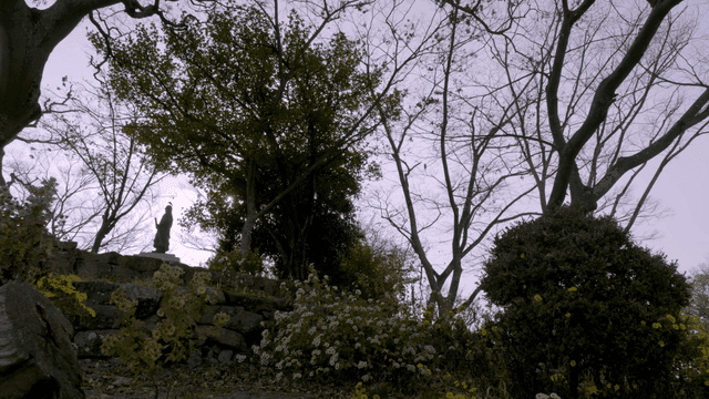 Tranquil garden with statues and trees