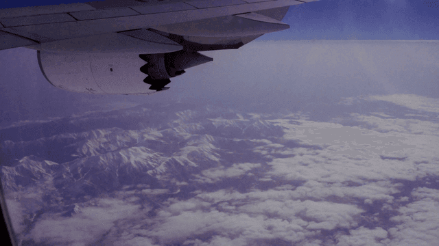 View of snowy mountains from an airplane
