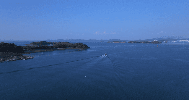 Ship sailing on vast blue sea
