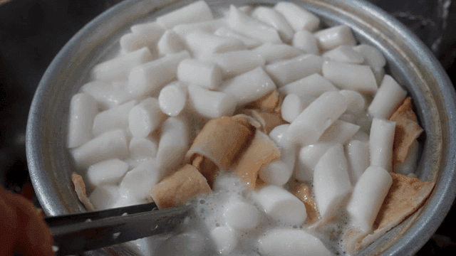 Korean rice cakes and fish cakes boiling in a pot