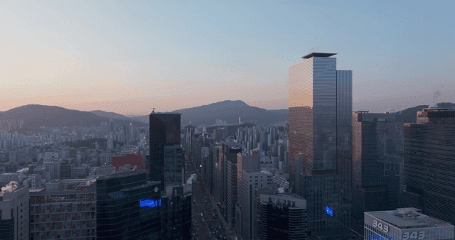 Evening city skyline with mountains