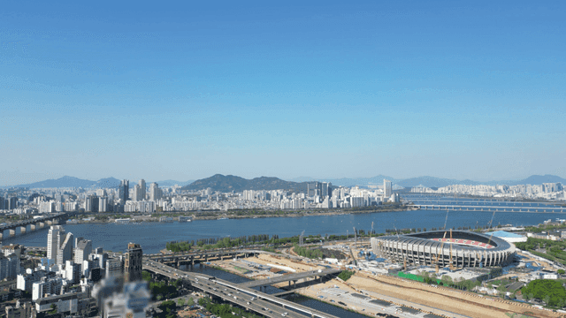 A panoramic view of a city with a river