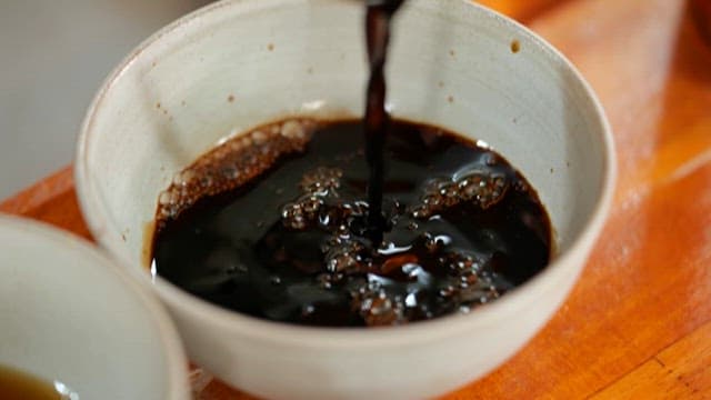 Brown Soy Sauce Poured into a Bowl on the Table