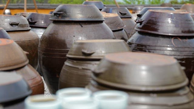 Traditional Pots, Earthenwares and Small Dishes for Soy Sauce on a Sunny Day