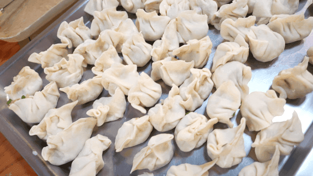 Freshly made dumpling dough on tray