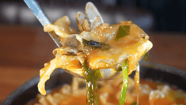 Spicy seafood dumplings topped with fillings