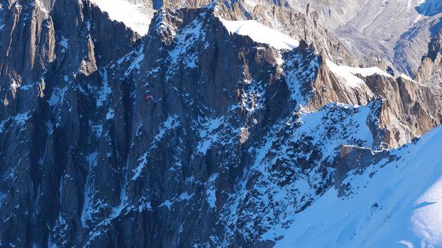 Paragliding over snow-covered mountains