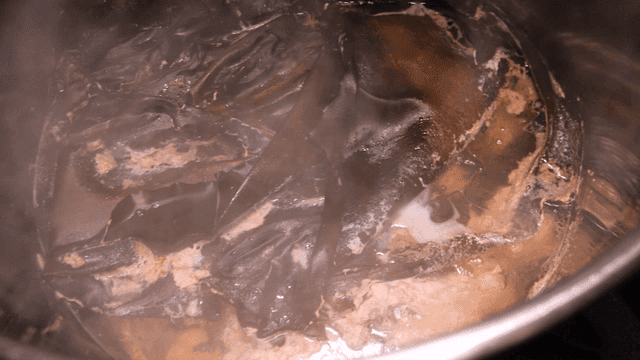 Kelp and chicken broth boiling in pot
