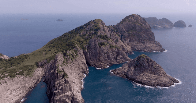 Rocky island surrounded by blue sea