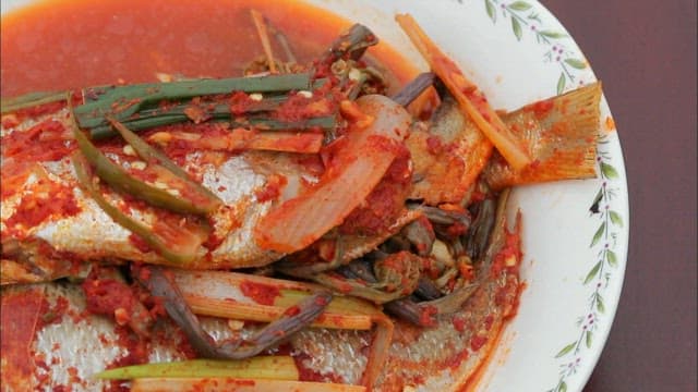 Braised yellow croaker on a plate on the table