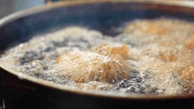 Gimbap fried in hot oil in pan