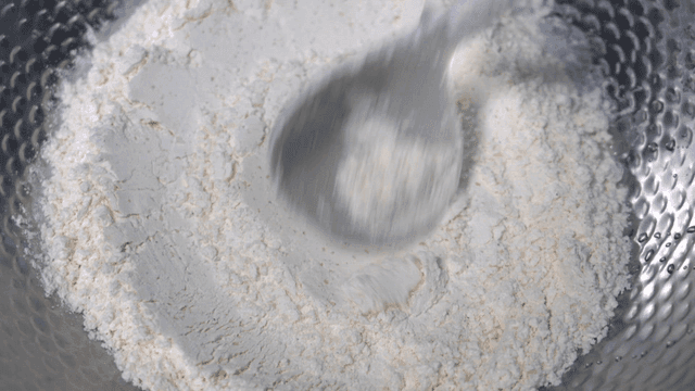 Ladle for mixing flour in metal bowl