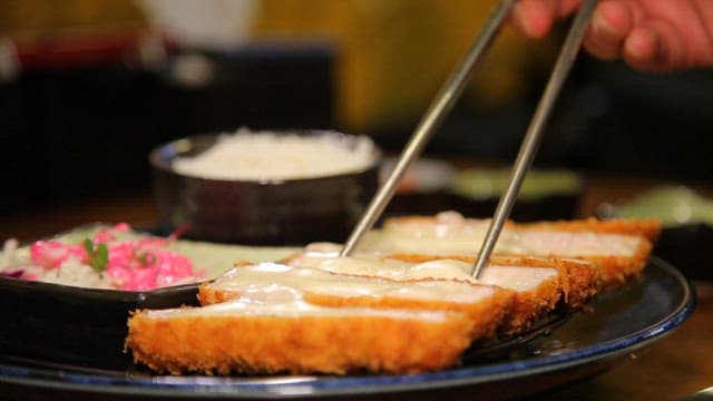 Cheese stretching from fried pork cutlet