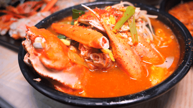 Spicy red crab ramen with crab and vegetables